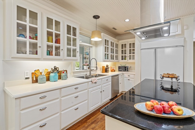 kitchen featuring paneled built in refrigerator, wood finished floors, a sink, white cabinetry, and dishwasher