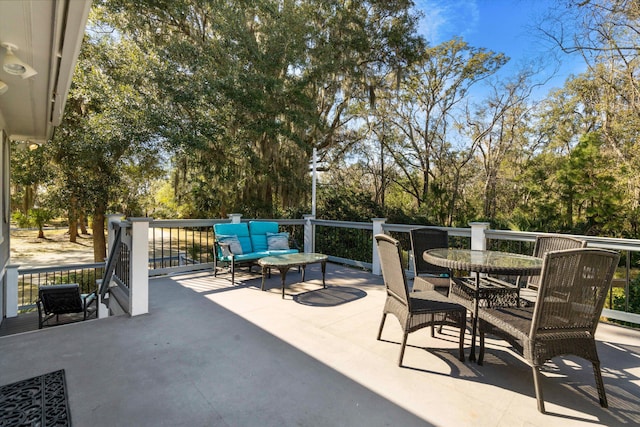 view of patio with an outdoor living space and outdoor dining space