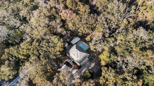 drone / aerial view featuring a view of trees