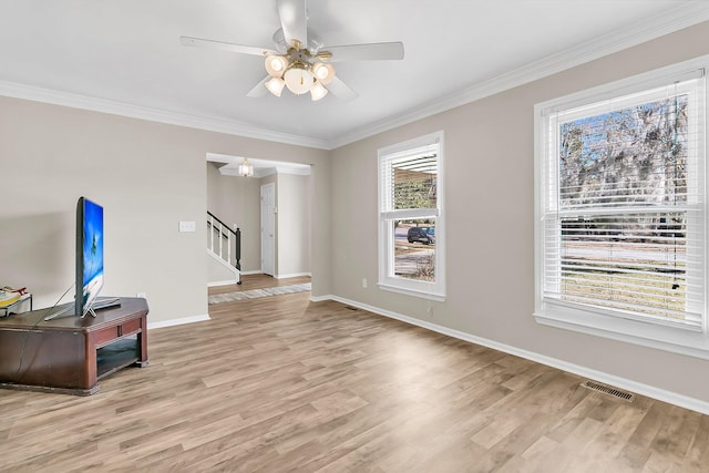 living room with ceiling fan, ornamental molding, and light hardwood / wood-style floors