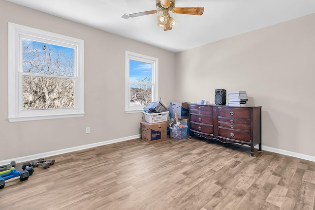 miscellaneous room featuring ceiling fan and light wood-type flooring