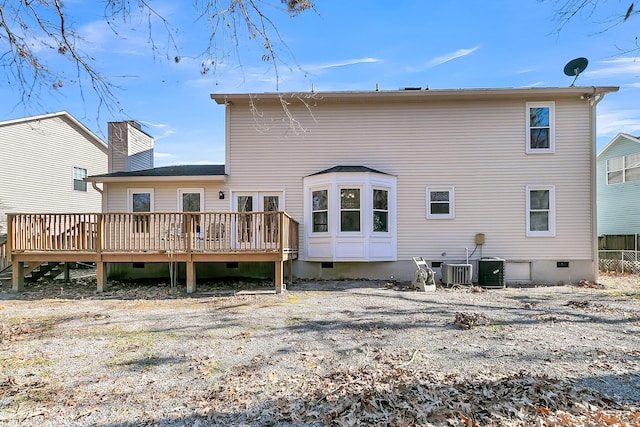 rear view of house featuring a deck and central air condition unit