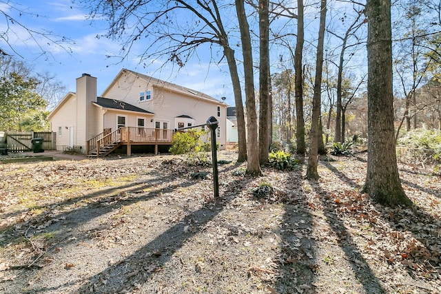 back of property with a wooden deck