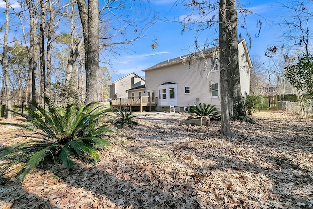 rear view of house with a wooden deck