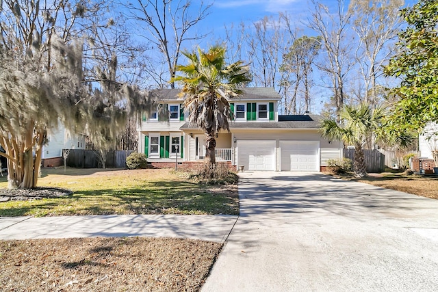 view of front of property with a garage and a front yard