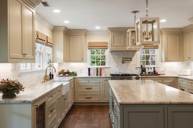 509 Klein St, Mount Pleasant, SC 29464 - kitchen with wine cooler, light stone countertops, a kitchen island, backsplash, and recessed lighting
