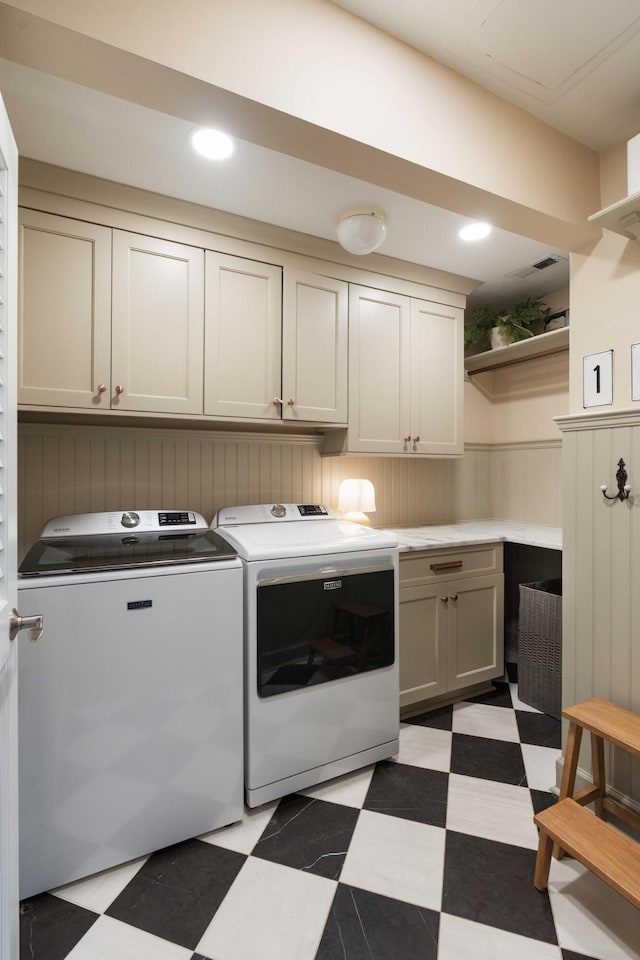 509 Klein St, Mount Pleasant, SC 29464 - laundry room with light flooring, cabinet space, washer and dryer, and a wainscoted wall