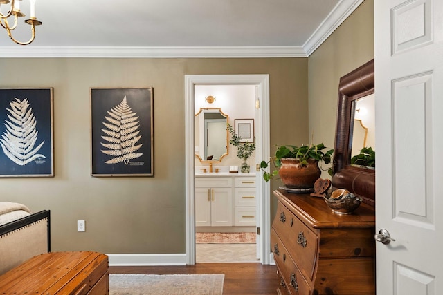 509 Klein St, Mount Pleasant, SC 29464 - corridor with dark wood-style floors, ornamental molding, and a chandelier