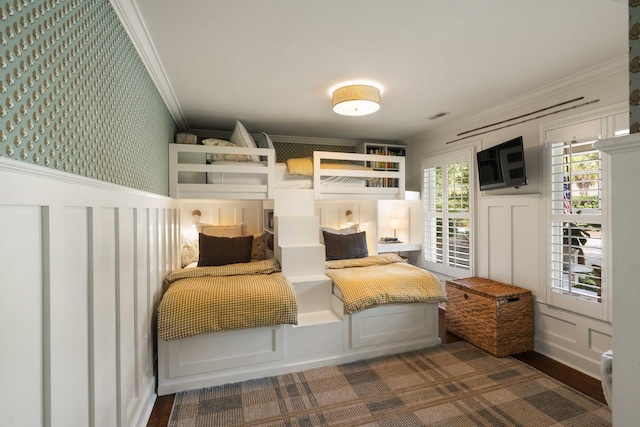 509 Klein St, Mount Pleasant, SC 29464 - bedroom with crown molding, a decorative wall, and wainscoting