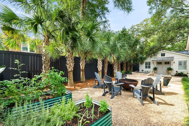 509 Klein St, Mount Pleasant, SC 29464 - view of yard with an outdoor fire pit, a garden, an outbuilding, and a patio area
