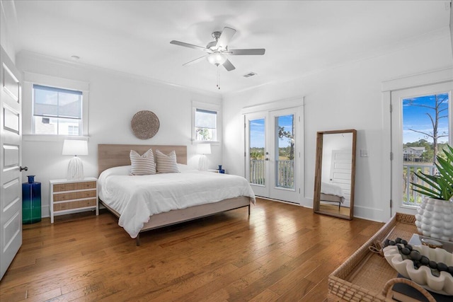 bedroom featuring access to outside, wood-type flooring, ceiling fan, and baseboards