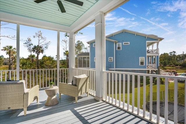 exterior space with ceiling fan and wood ceiling