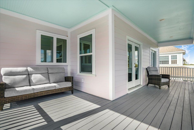 deck featuring an outdoor hangout area and french doors