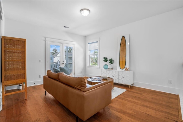 living room featuring wood finished floors and baseboards