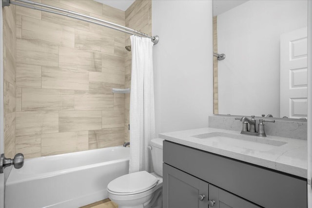 full bathroom featuring toilet, shower / bathtub combination with curtain, and vanity