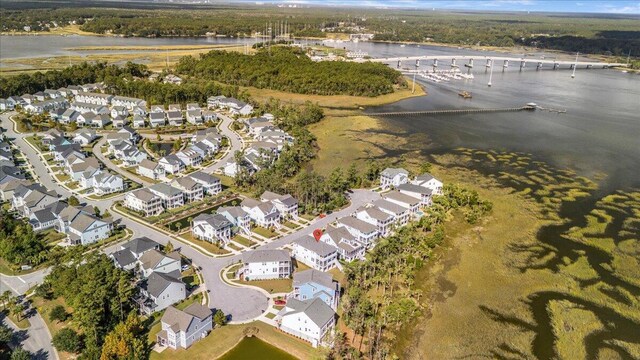 aerial view of property's location featuring a notable bridge, a nearby body of water, and nearby suburban area
