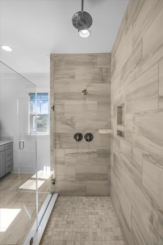 bathroom featuring a shower with door