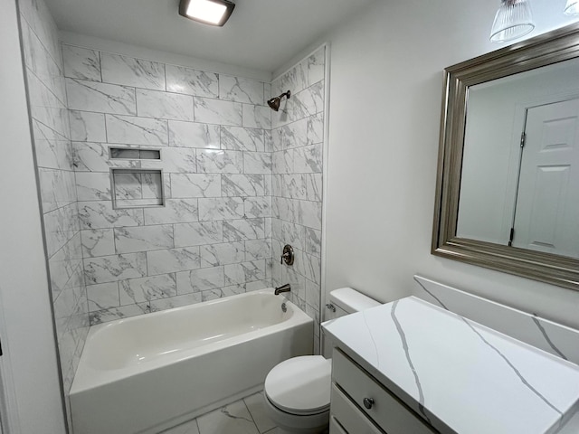 full bathroom with tiled shower / bath, vanity, and toilet