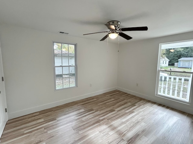 spare room featuring ceiling fan and light hardwood / wood-style flooring