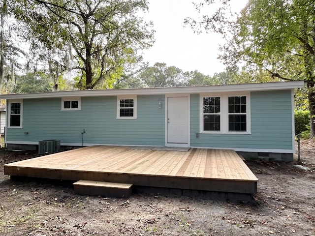 rear view of house with cooling unit and a deck