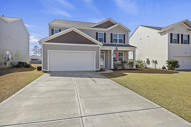 view of front of home featuring a garage, concrete driveway, a front lawn, and a porch