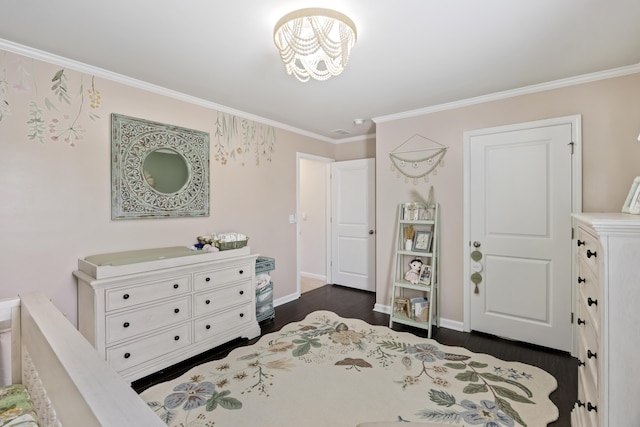 bedroom featuring ornamental molding, dark wood-type flooring, and baseboards