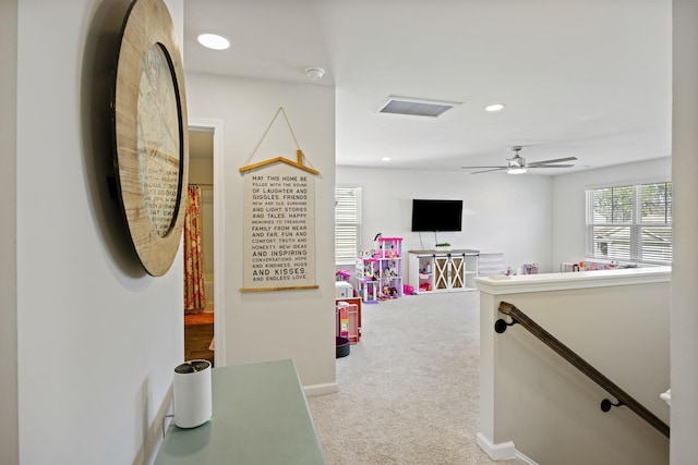 hall featuring recessed lighting, visible vents, carpet flooring, an upstairs landing, and baseboards