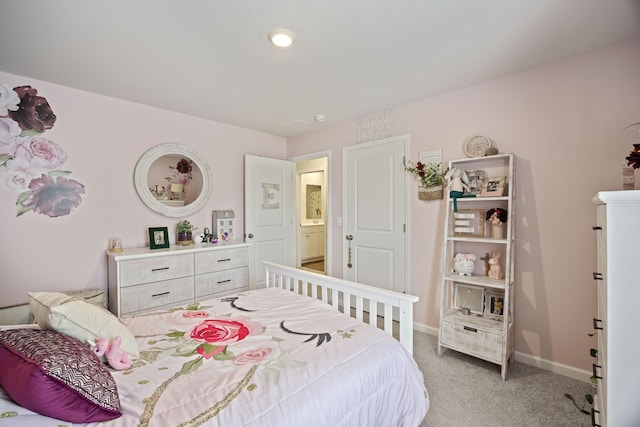 bedroom featuring baseboards and light colored carpet