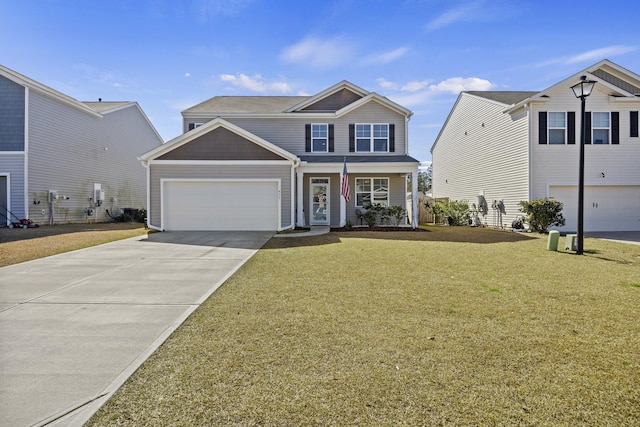 traditional-style home with a garage, a front lawn, and concrete driveway