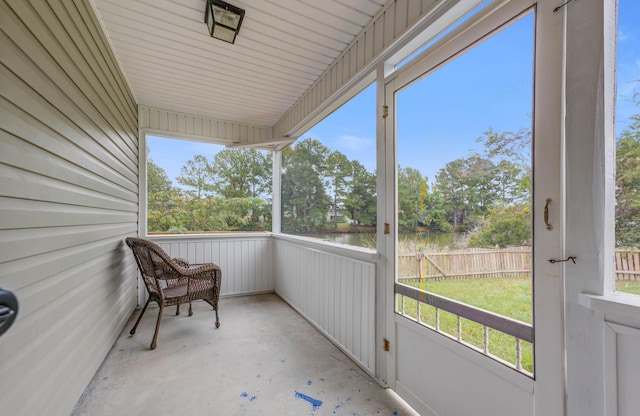 balcony featuring a water view
