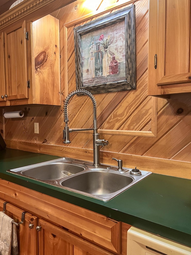 kitchen featuring dishwasher and a sink