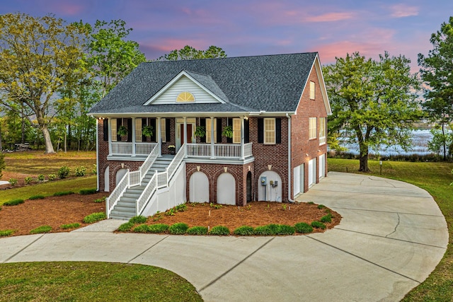 view of front of home with a porch and a garage