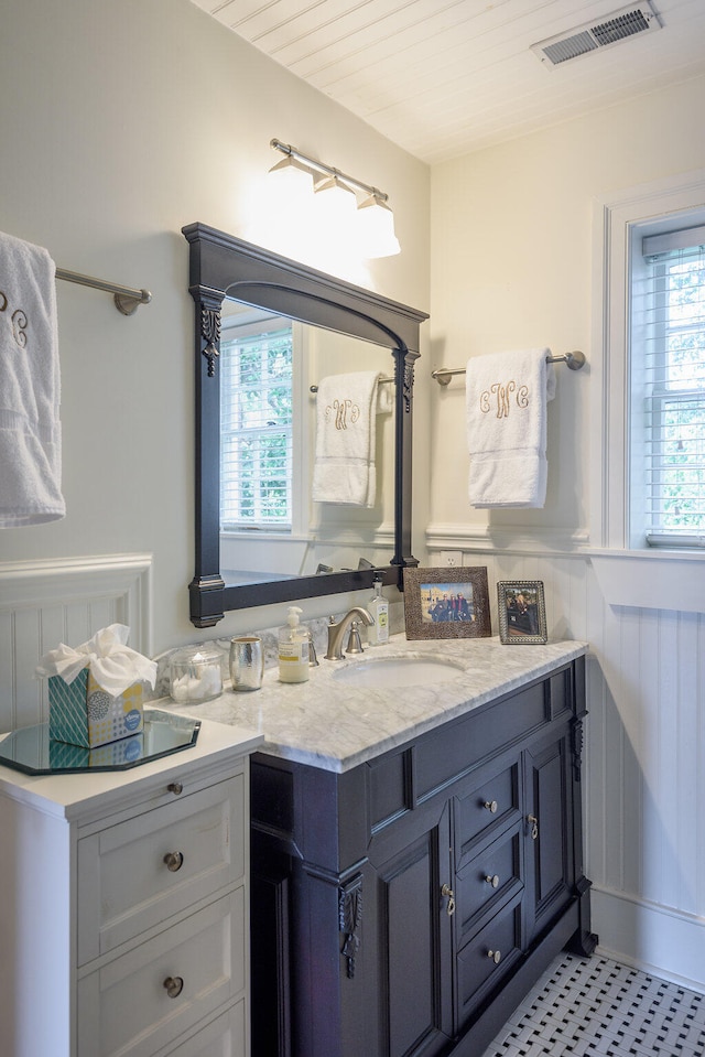 bathroom with vanity and tile patterned flooring