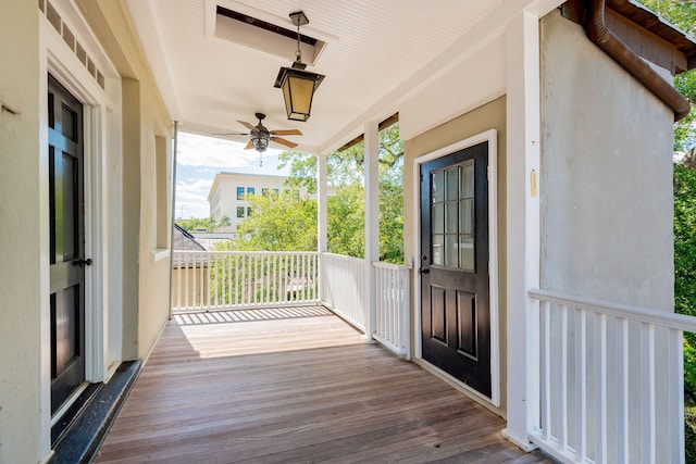 wooden deck with ceiling fan