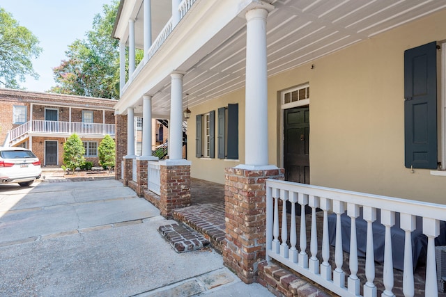 entrance to property featuring covered porch