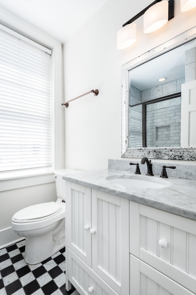 bathroom with tile patterned floors, toilet, and vanity