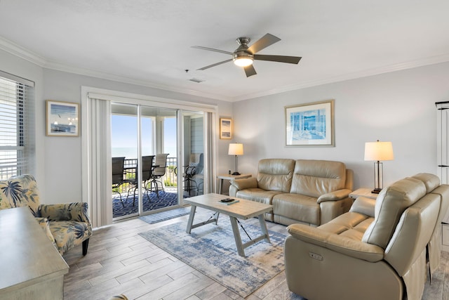 living area featuring crown molding, a ceiling fan, visible vents, and light wood-style floors