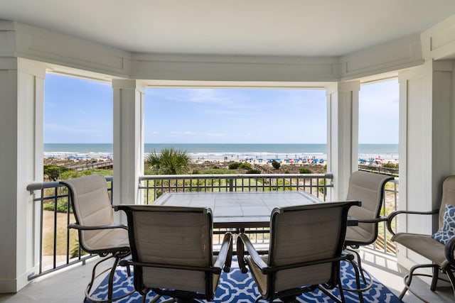 sunroom with a water view