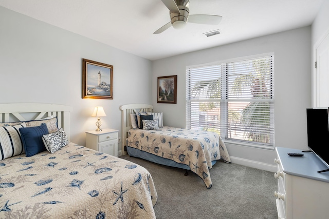 bedroom with baseboards, a ceiling fan, carpet flooring, and visible vents