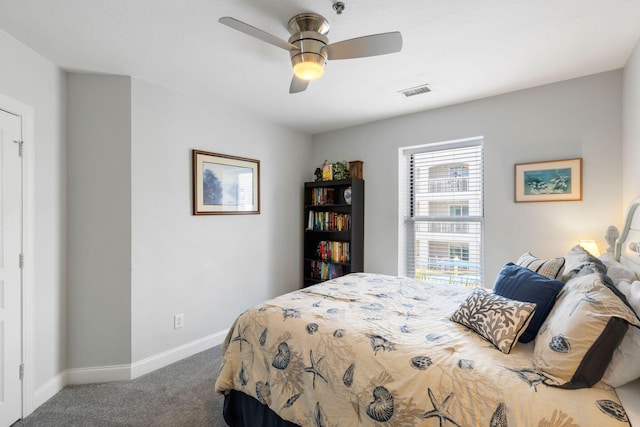 bedroom featuring baseboards, carpet flooring, ceiling fan, and visible vents