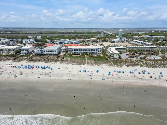 birds eye view of property featuring a water view and a view of the beach