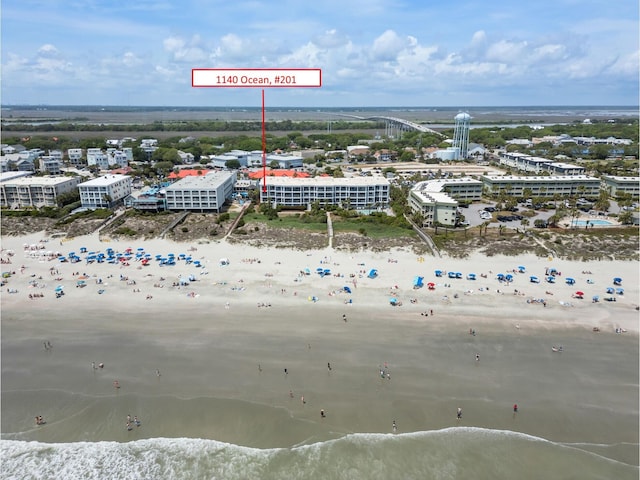 aerial view with a water view and a view of the beach