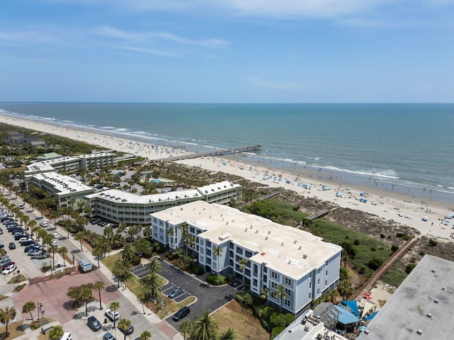 birds eye view of property with a water view and a view of the beach