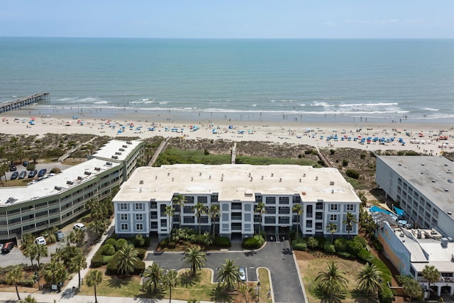 birds eye view of property featuring a water view and a view of the beach