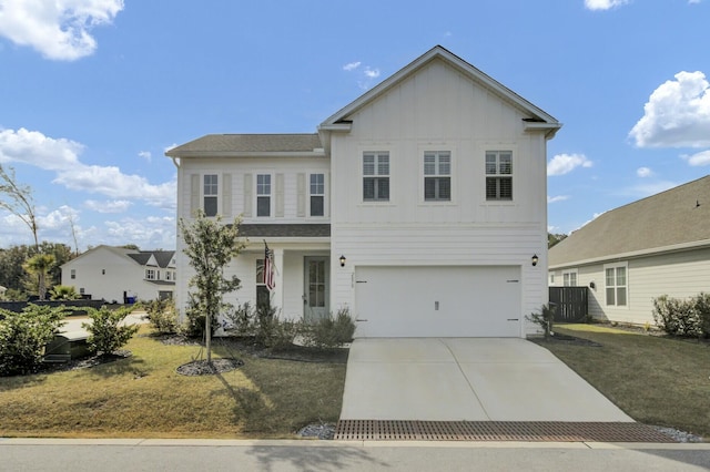 front of property with a front yard and a garage