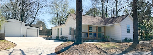 6 Littlefield St, Inman, SC 29349 - view of front of home featuring a porch, an outbuilding, a detached garage, and roof with shingles