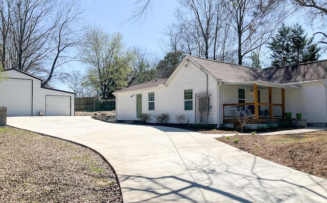 6 Littlefield St, Inman, SC 29349 - view of property exterior featuring a porch, an outdoor structure, concrete driveway, and roof with shingles
