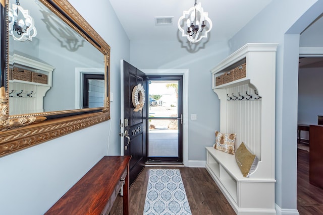 mudroom featuring a chandelier and dark hardwood / wood-style flooring