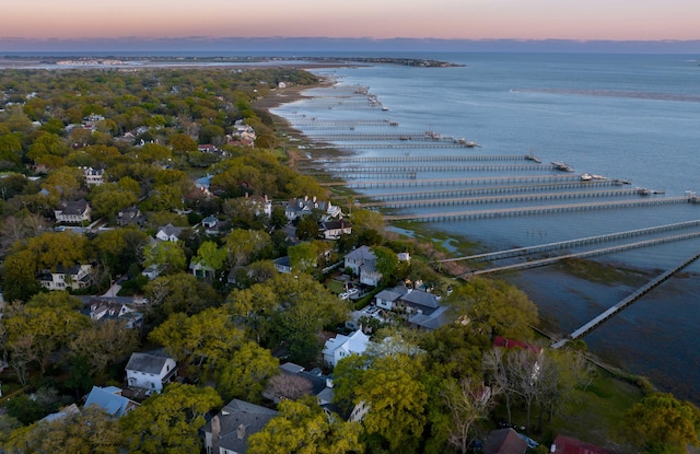 aerial view at dusk with a water view