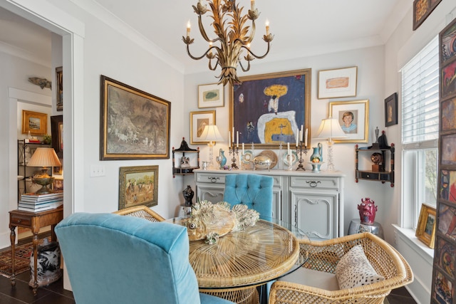 dining area with a notable chandelier and crown molding